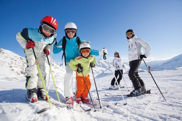 a family posing for the camera during a ski trip