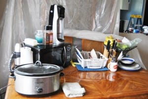 a dining table with kitchen appliances