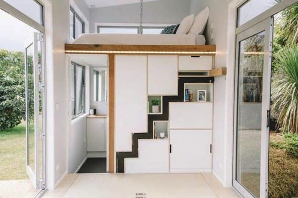 a loft bed with an understairs drawer