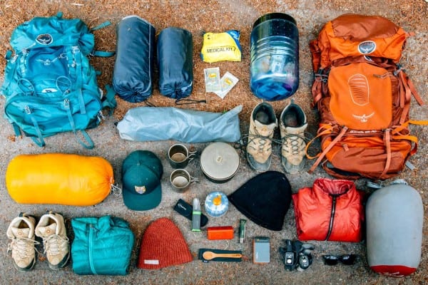 assorted camping gear on the ground