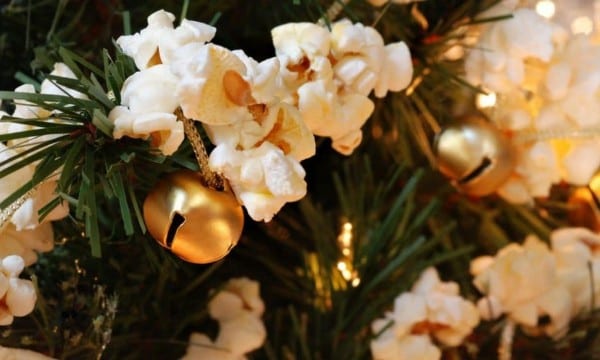 A popcorn garland decorated around a christmas tree